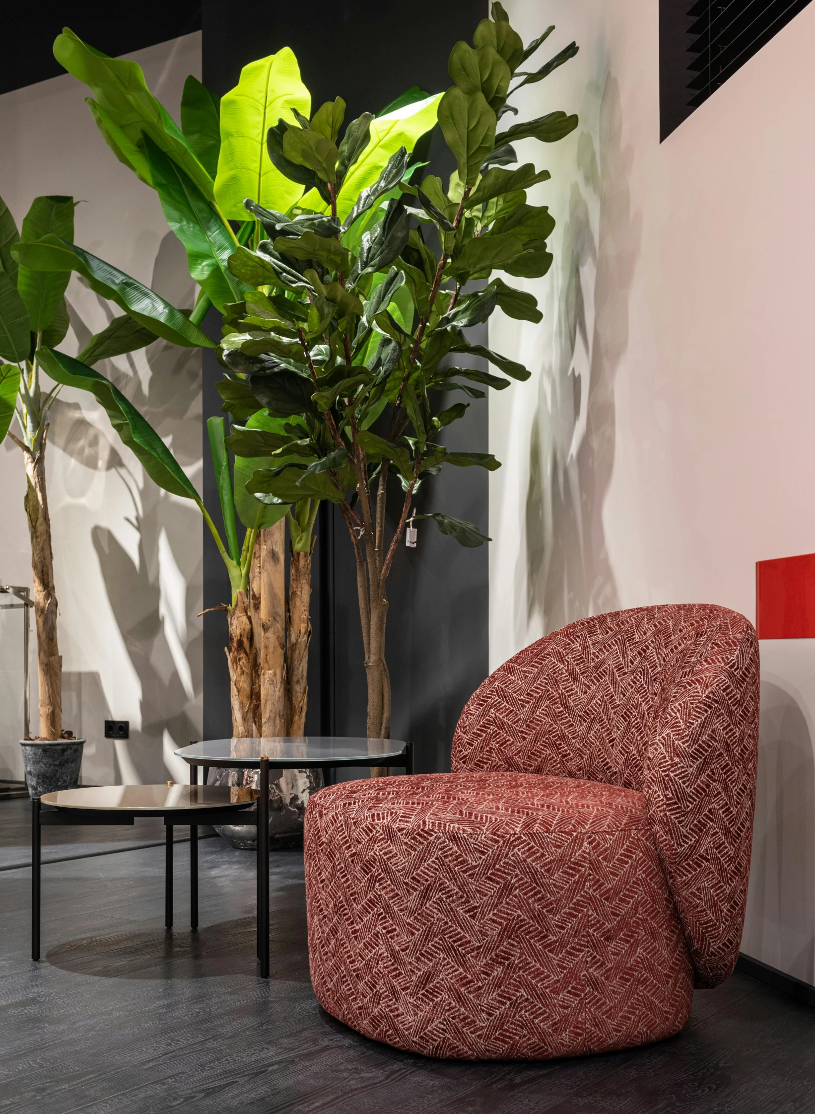a red chair sitting in a living room next to a potted plant, inspired by Jan Wijnants, dezeen showroom, thumbnail, cityscape, high textured