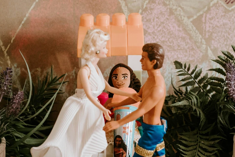 a couple of figurines standing next to each other, by Lee Loughridge, pexels contest winner, pop art, barbie or ken doll, megan fox made out of mayonnaise, 1960s orientalism, beach aesthetic