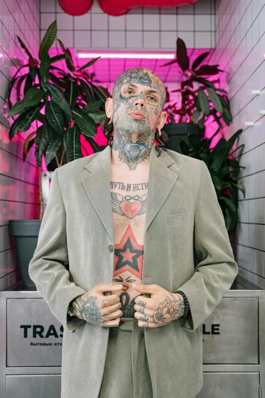 a man with tattoos wearing a suit and tie, inspired by James Bolivar Manson, transgressive art, travis scott, slide show, taken in 2 0 2 0, pentagram