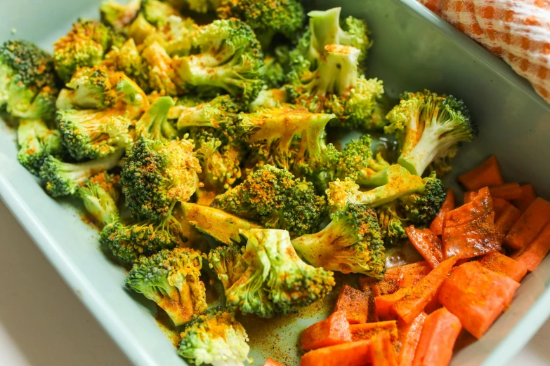 a close up of a plate of broccoli and carrots, by Julia Pishtar, red and orange colored, wētā fx, sri lanka, crispy