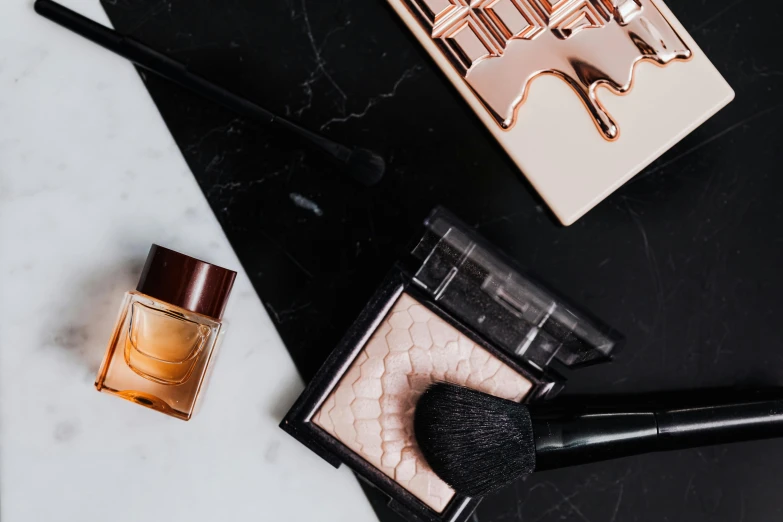 a close up of makeup products on a table, by Julia Pishtar, trending on pexels, baroque, copper details, all marble, all black matte product, high gloss