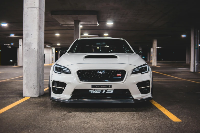 a white subarunt parked in a parking garage, inspired by An Gyeon, pexels contest winner, wrx golf, cinematic front lightning, instagram post, slight overcast lighting