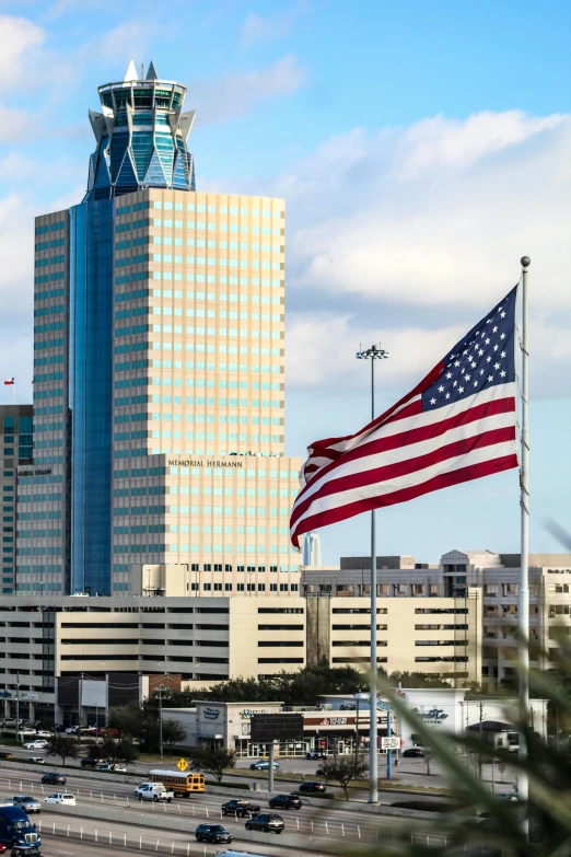 an american flag flying in front of a city skyline, downtown jacksonville florida, slide show, square, armadillo patriot potus