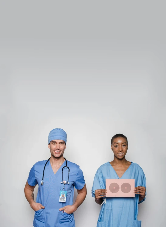a couple of doctors standing next to each other, inspired by Julius Klinger, shutterstock contest winner, renaissance, cardboard cutout, mauve and cyan, 2019 trending photo, small in size