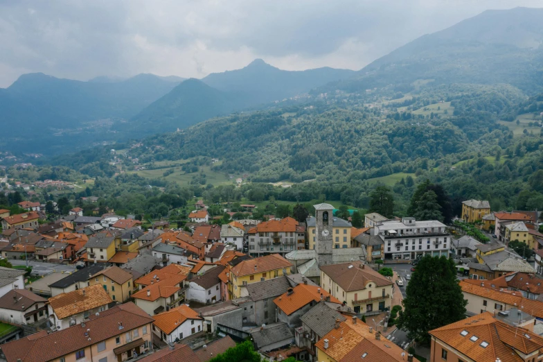 a view of a town with mountains in the background, pexels contest winner, renaissance, square, portrait image, bizzaro, high angle shot