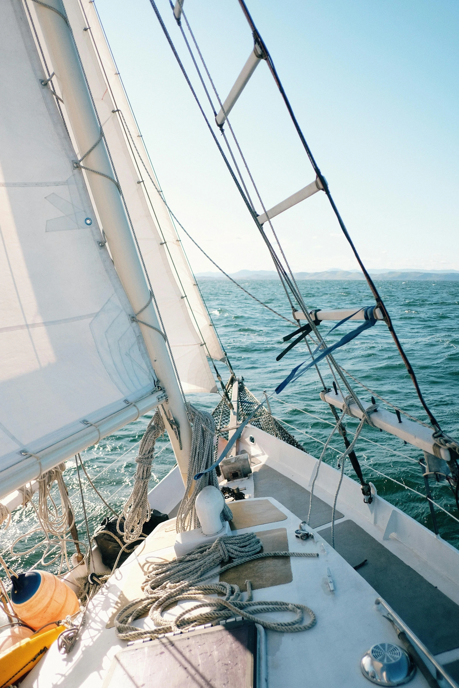 a man riding on the back of a sailboat, inspired by Willem van de Velde the Elder, unsplash, high angle close up shot, abel tasman, high winds, lots of detail