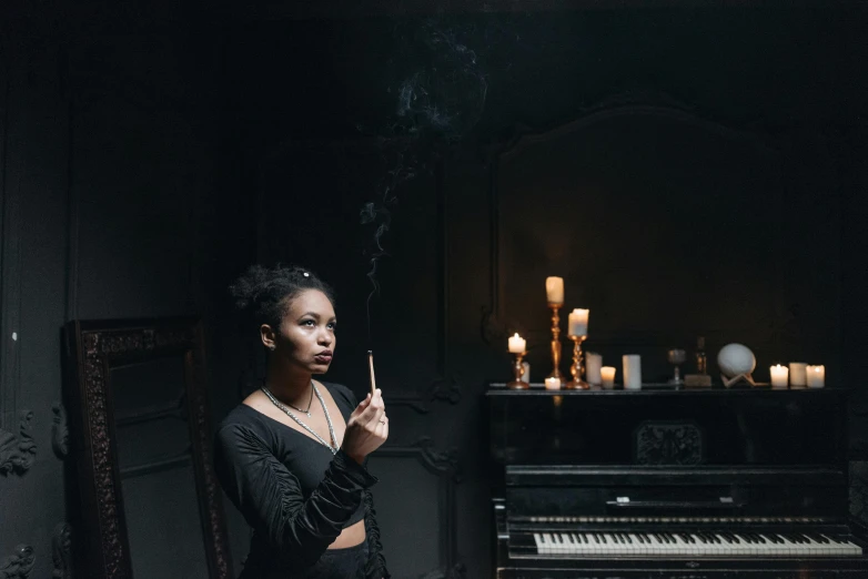 a woman standing in front of a piano smoking a cigarette, inspired by Elsa Bleda, pexels contest winner, in a halloween style, ashteroth, a seance, gothic style