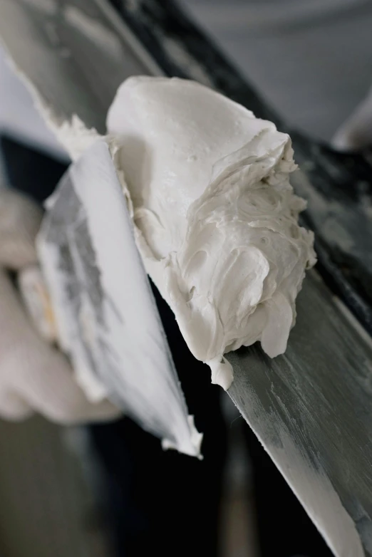 a person cutting a piece of cake with a knife, a marble sculpture, inspired by Julio Larraz, unsplash, detail texture, toothpaste refinery, in oil”, aluminum