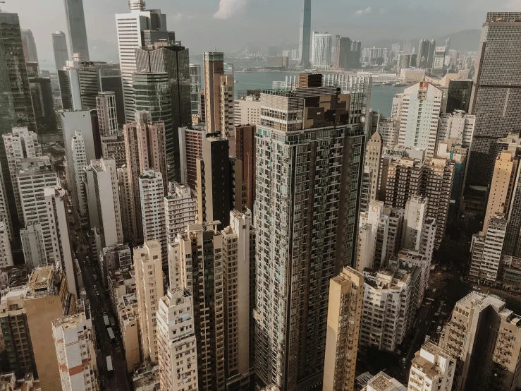 a view of a city from the top of a building, pexels contest winner, hyperrealism, hong kong buildings, low quality footage, stacked image, full building