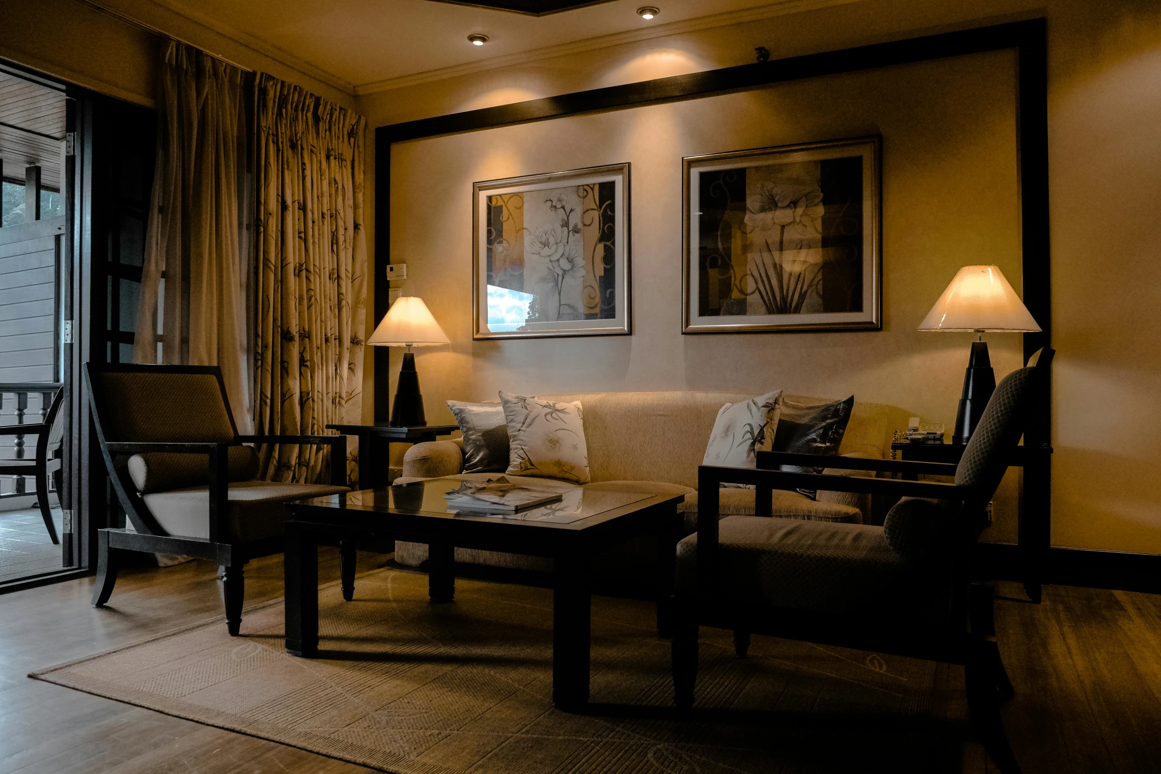 a living room filled with furniture and a sliding glass door, pexels contest winner, low lighting, brown and cream color scheme, thumbnail, hotel room