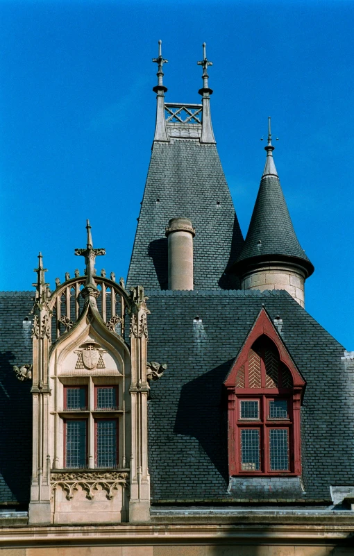 a large building with a clock on top of it, inspired by Limbourg brothers, exterior view, stone roof, 1996), gothic castle