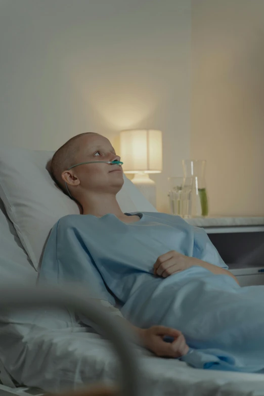 a woman is laying in a hospital bed, happening, bald, profile image, ( ( theatrical ) ), cinematic lut