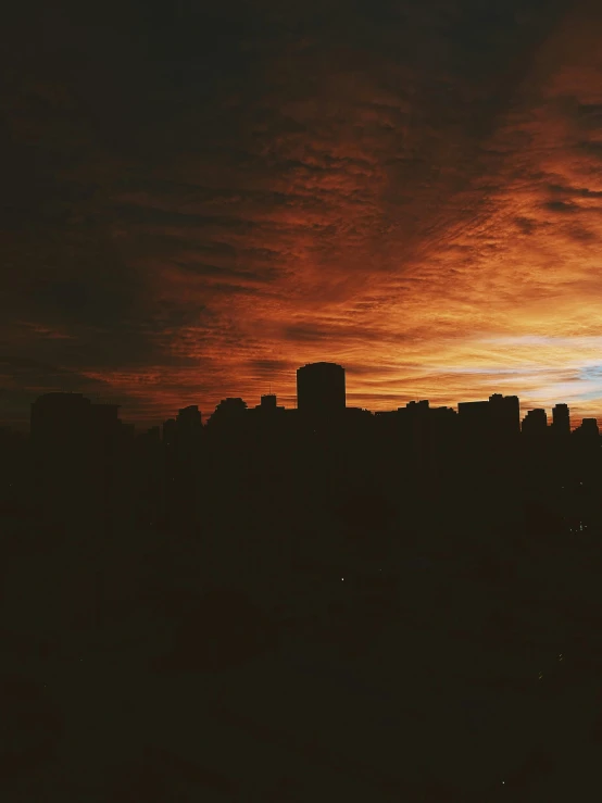the sun is setting over the city skyline, a picture, inspired by Elsa Bleda, happening, trending on vsco, album cover, spooky photo, vancouver