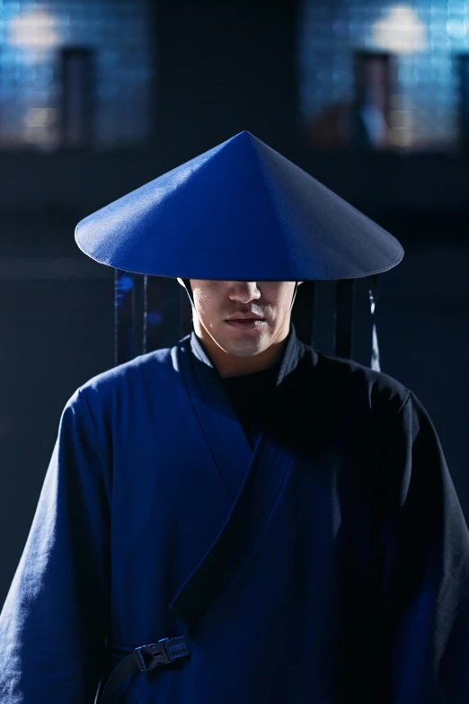 a man with a blue hat on his head, inspired by Ma Shi, featured on reddit, wearing black robe, matrix ), pagoda, ( ( theatrical ) )