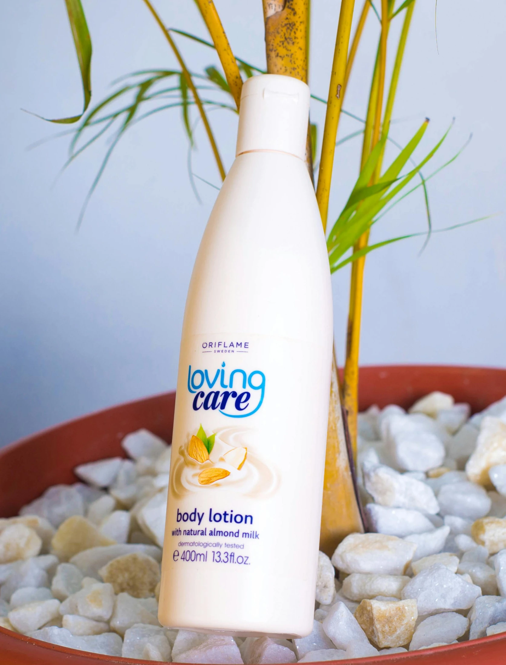 a bottle of body lotion sitting next to a plant, hoang lap, high quality product image”, 0, 4l