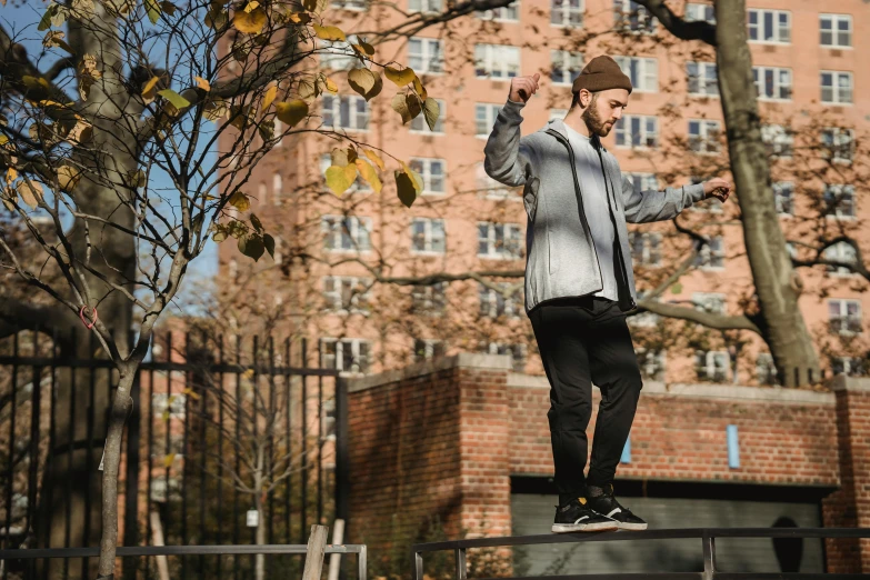 a man flying through the air while riding a skateboard, a portrait, unsplash, realism, cinematic outfit photo, humans of new york style, standing on top of a piano, thumbnail