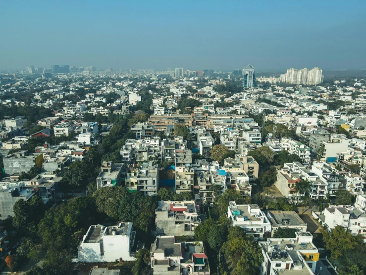 an aerial view of a city with tall buildings, pexels, bauhaus, beautiful futuristic new delhi, low ultrawide shot, residential area, white buildings