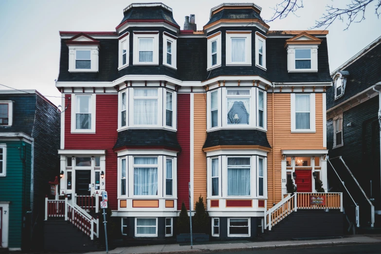 a multi - colored house on the corner of a street, pexels contest winner, red black white golden colors, in a row, interior of a victorian house, 🦩🪐🐞👩🏻🦳