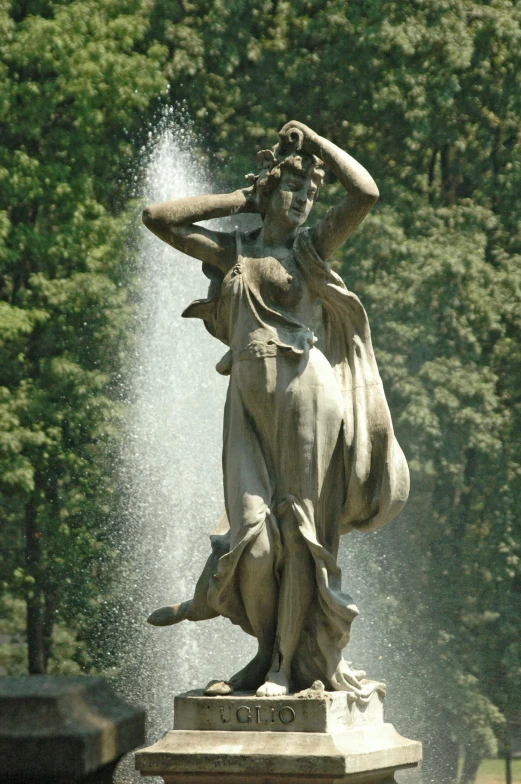 a statue of a woman standing next to a fountain, twirling, head to waist, no cropping, monumental