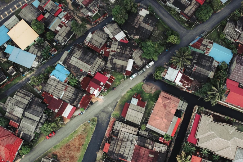 a bird's eye view of a small town, a portrait, unsplash, conceptual art, south jakarta, ruined subdivision houses, official screenshot, red roofs