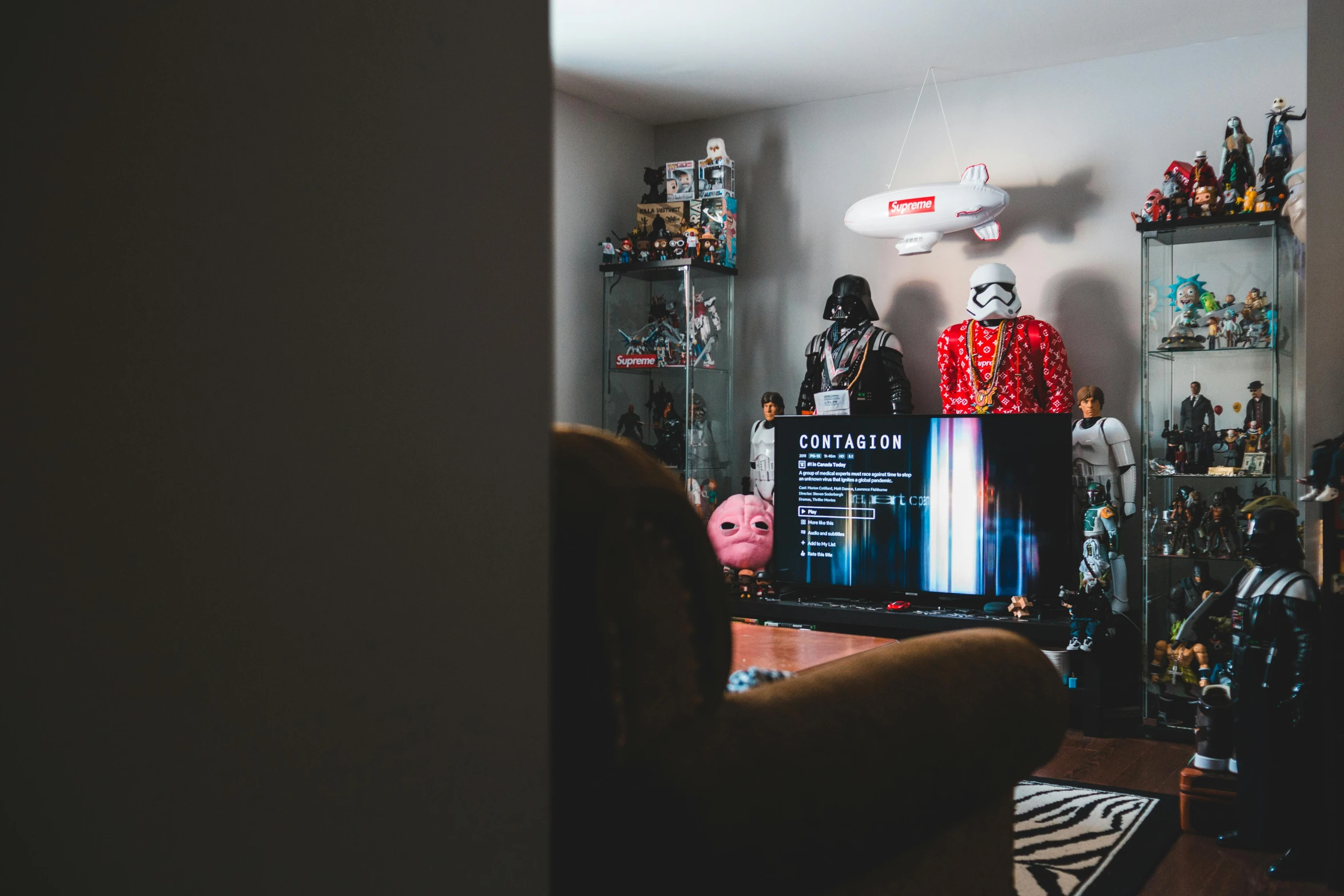 a living room filled with furniture and a flat screen tv, a hologram, by Julia Pishtar, unsplash, action figures, full costume, starwars, cinematic outfit photo