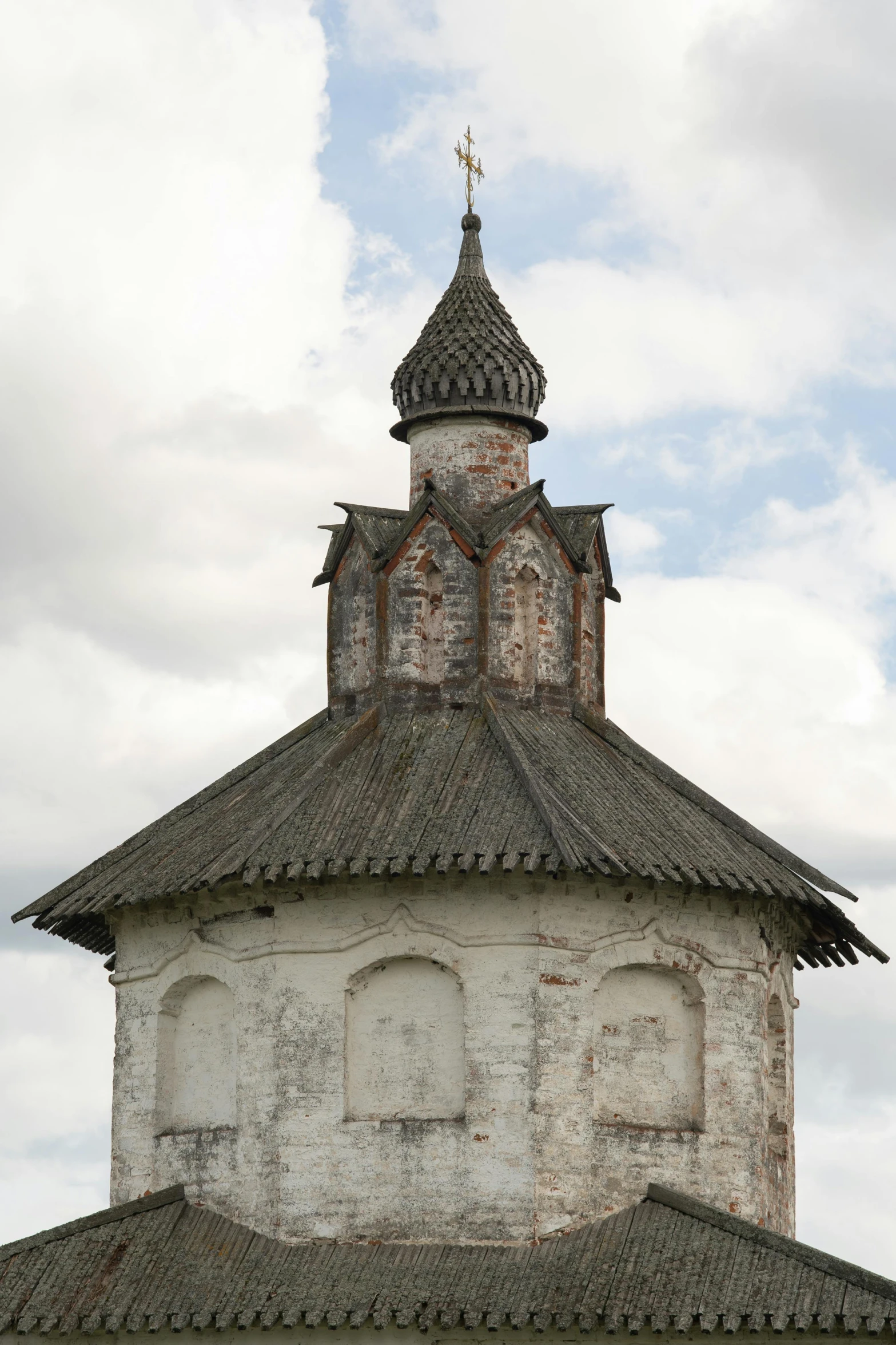 an old church with a steeple on a cloudy day, an album cover, inspired by Andrei Rublev, unsplash, romanesque, rounded roof, detail structure, levitan, may)
