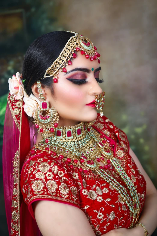 a woman wearing a red and gold bridal, a portrait, inspired by Saurabh Jethani, pixabay, photo of a model, very very very beautifull face, silver jewellery, vibrant scene