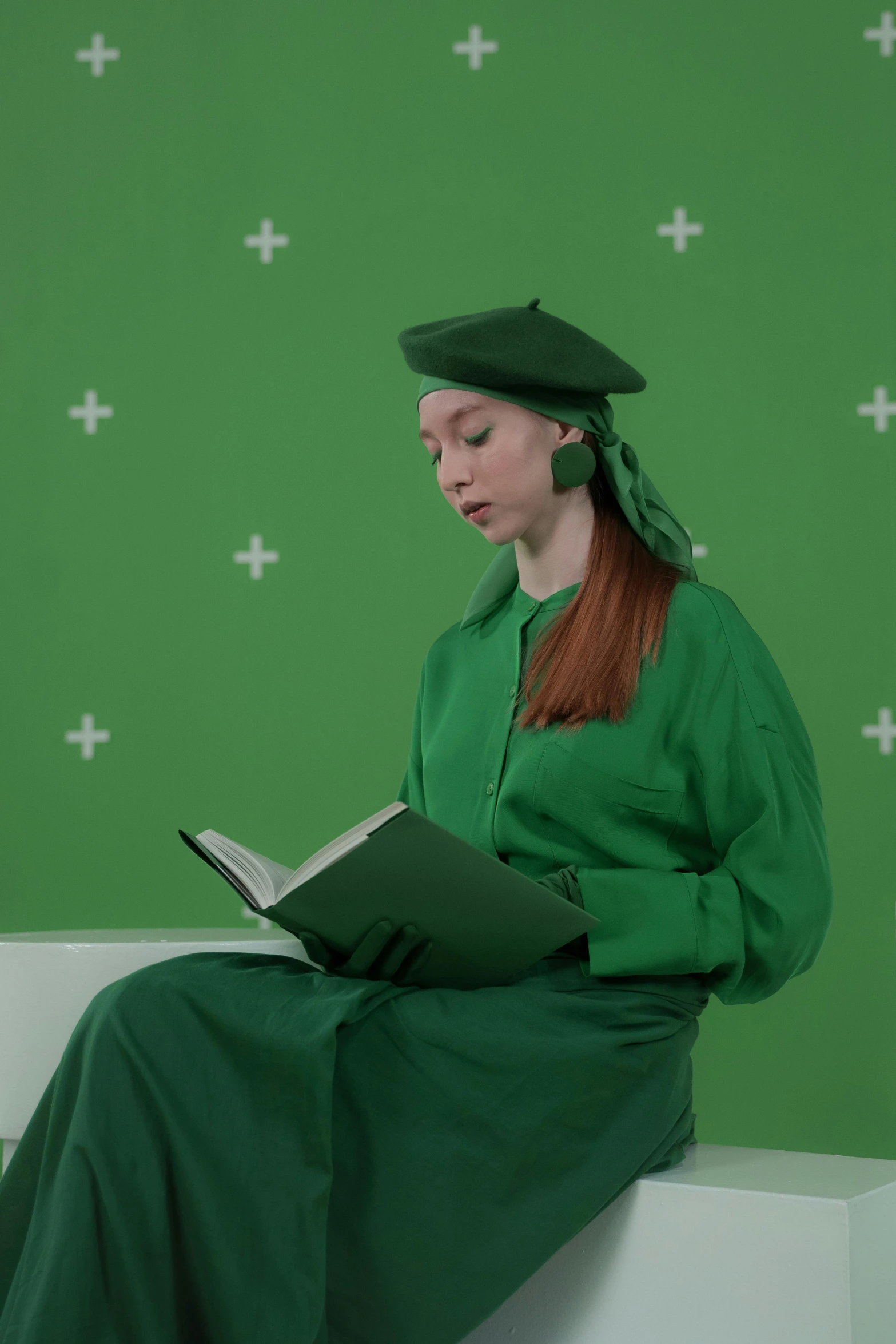 a woman sitting on a bench reading a book, inspired by Barthélemy d'Eyck, academic art, green screen, an oversized beret, showstudio, wearing an academic gown