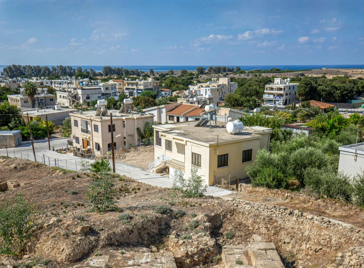 a view of a town from the top of a hill, cyprus, concrete housing, portrait image, ayne haag