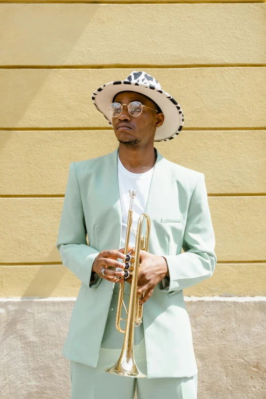 a man in a suit and hat holding a trumpet, an album cover, inspired by Barthélemy Menn, pexels contest winner, summer weather, profile image, tall thin, mint condition