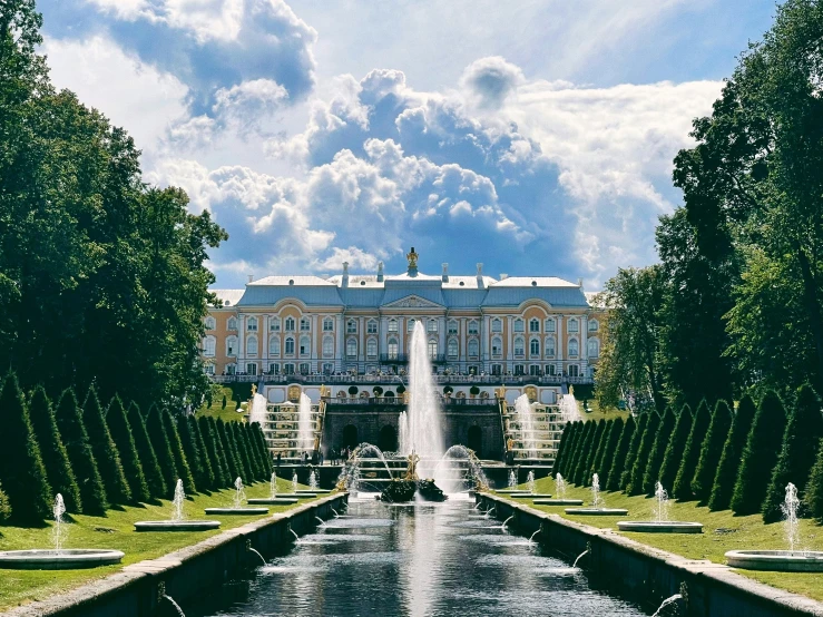 a large building with a fountain in front of it, an album cover, inspired by Illarion Pryanishnikov, pexels contest winner, neoclassicism, canals, lush surroundings, russia, thumbnail