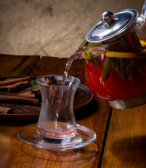 a tea pot pouring water into a cup, a still life, pexels, hurufiyya, square, tavern, splash image, romanian