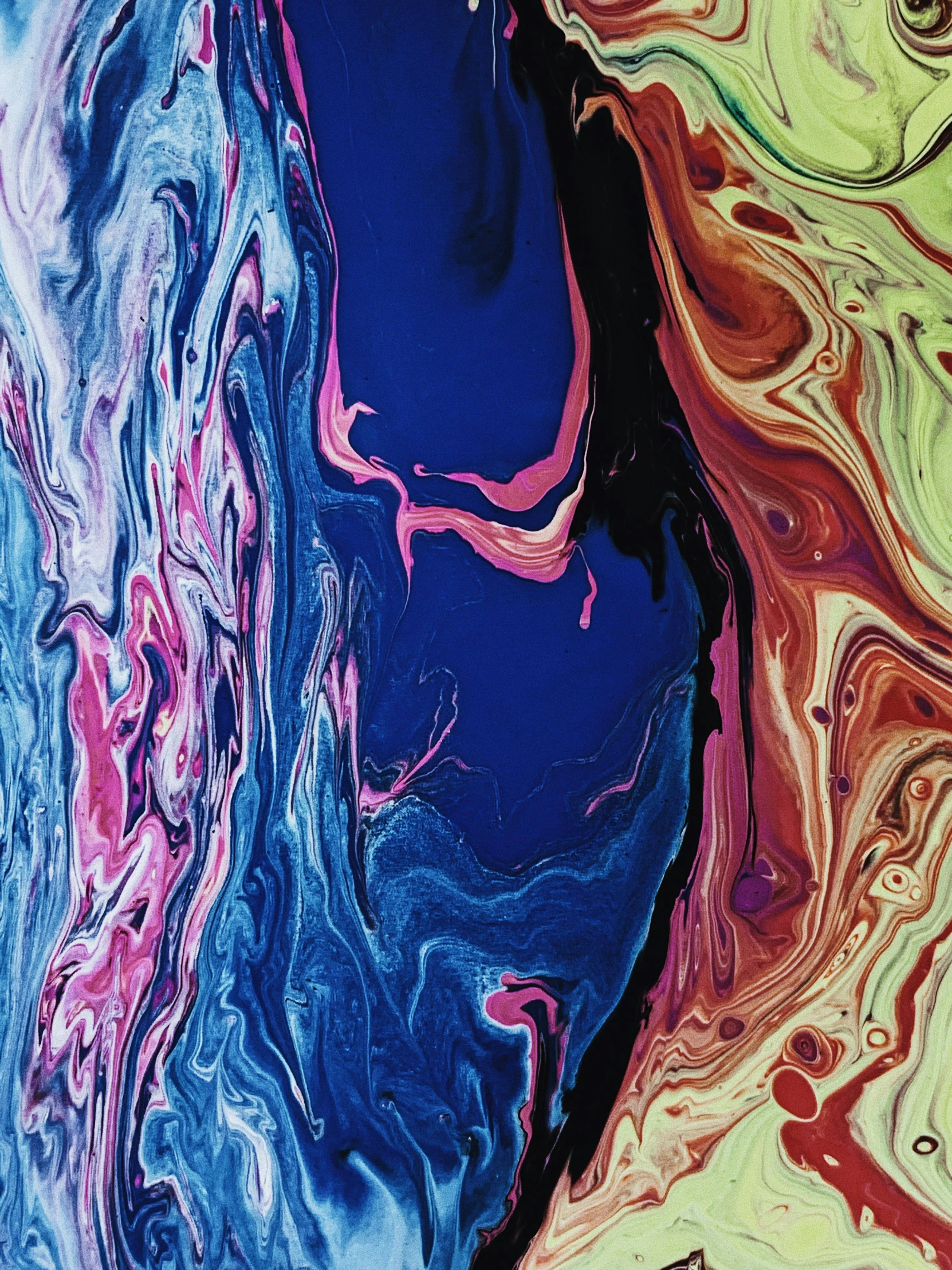a close up of a cell phone on a table, an abstract painting, inspired by Shōzō Shimamoto, unsplash, made of liquid, multi colored, indigo rainbow, color image