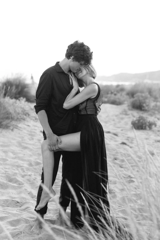 a black and white photo of a couple kissing on the beach, renaissance, hugging her knees, gif, more intense, sk