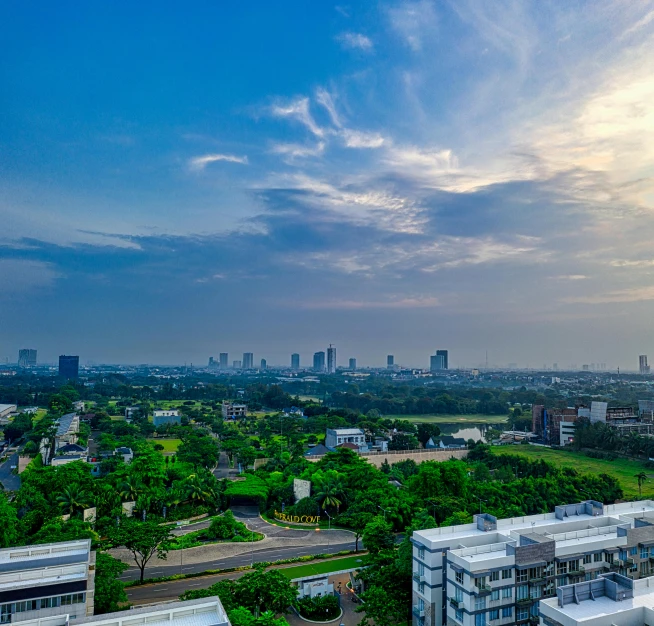 a view of a city from the top of a building, by Basuki Abdullah, university, fan favorite, bright sky, ultrawide image