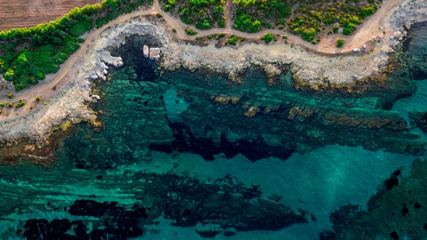 an aerial view of a large body of water, by Giuseppe Avanzi, pexels contest winner, photorealism, grotto, cyprus, ultrawide lens”