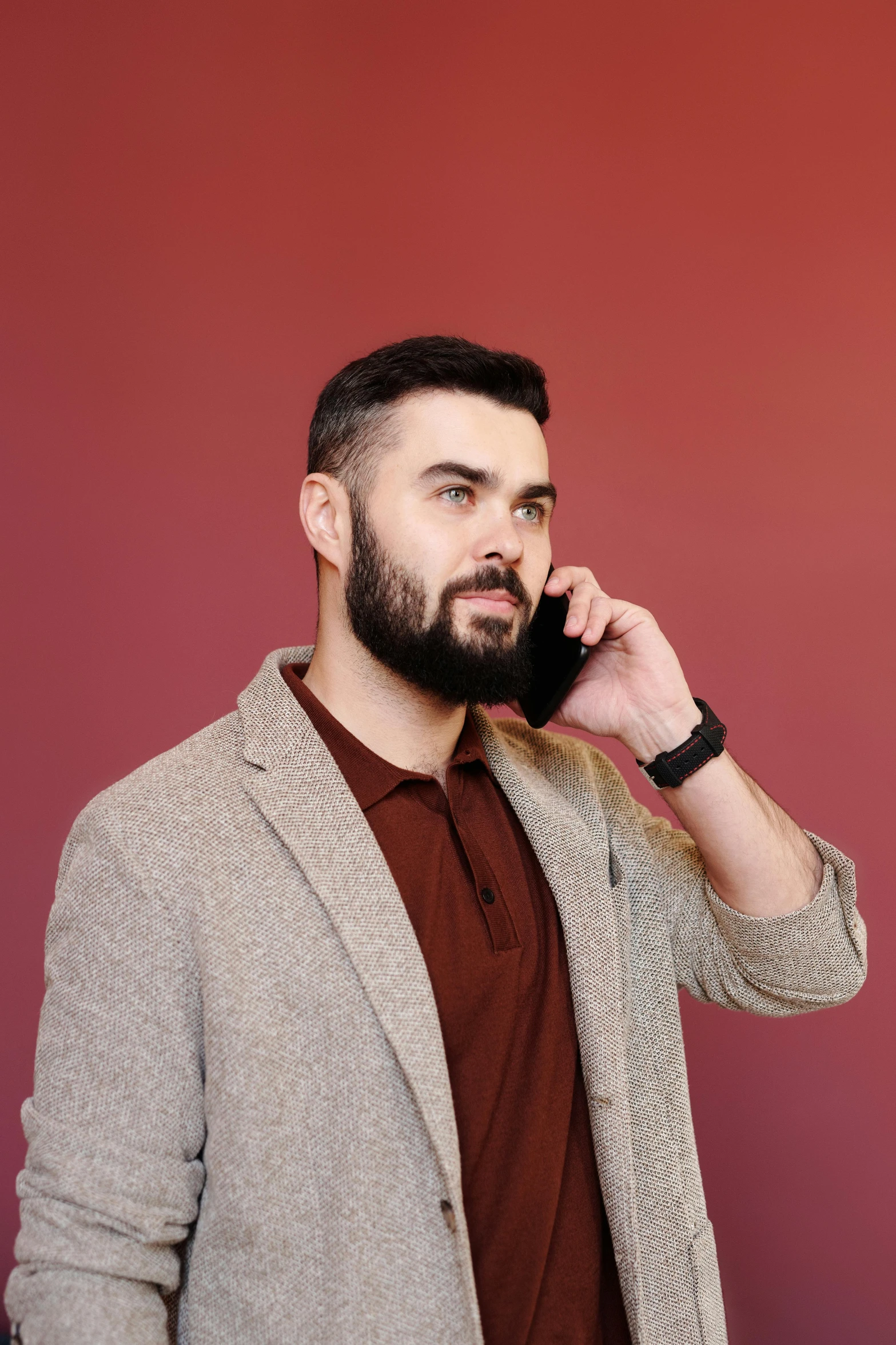 a man with a beard talking on a cell phone, trending on pexels, realism, maroon, professional modeling, ben shapiro, full body model