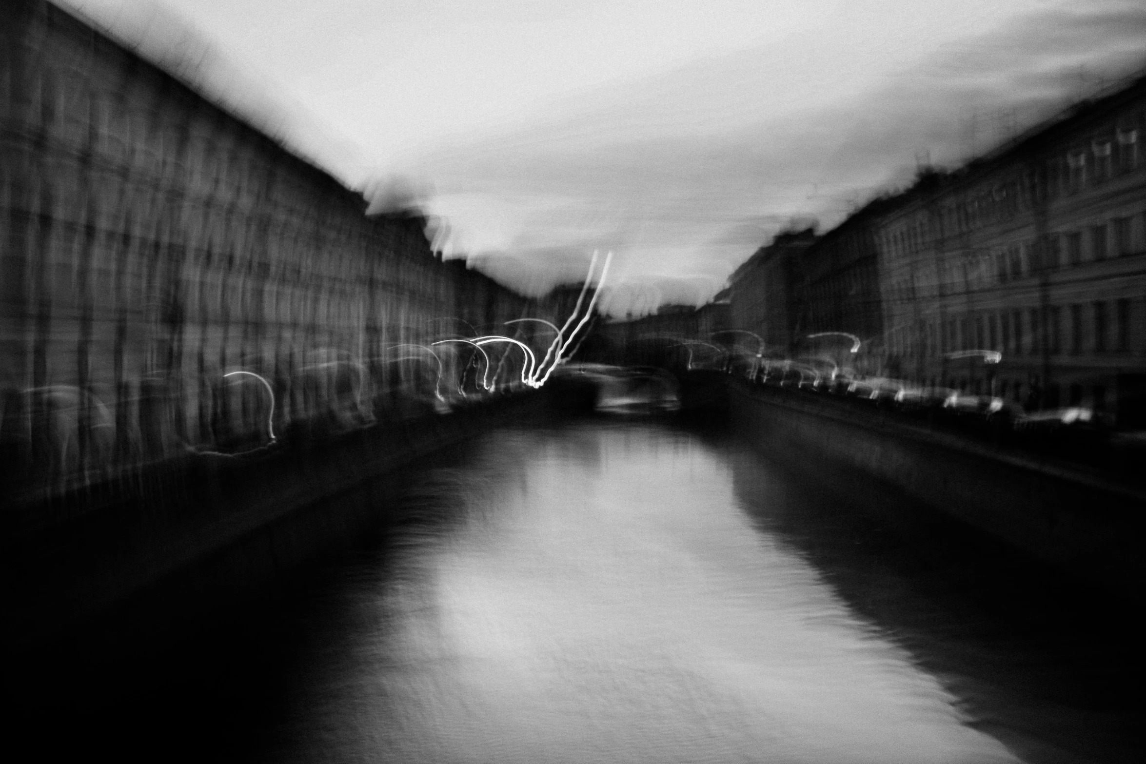 a black and white photo of a river, a black and white photo, by andrei riabovitchev, surrealism, saatchi art, floating lights, saint petersburg, expressive!!!!!