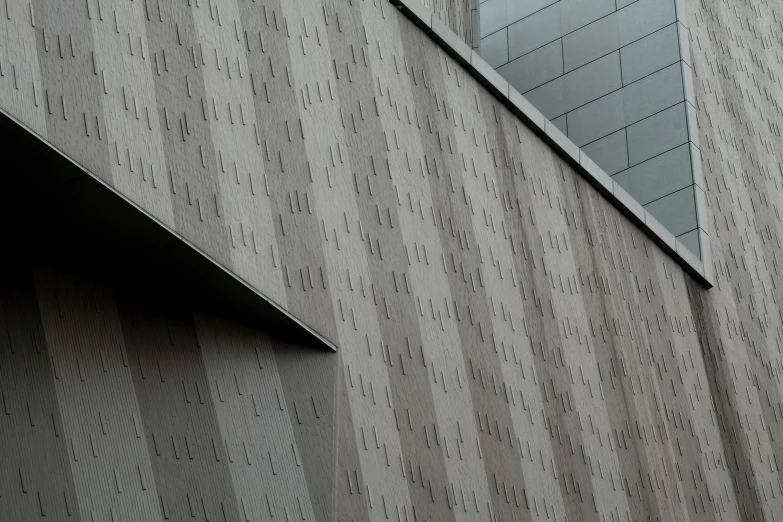 a clock that is on the side of a building, inspired by David Chipperfield, skin grain detail, luxcore render, patterned, from the distance