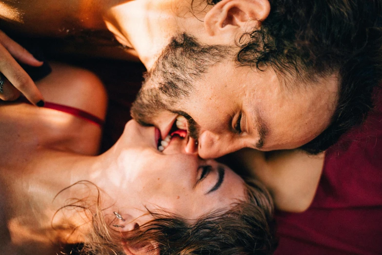 a man and a woman laying next to each other, trending on pexels, renaissance, licking tongue, sensual and beautiful incubus, bottom angle, profile image