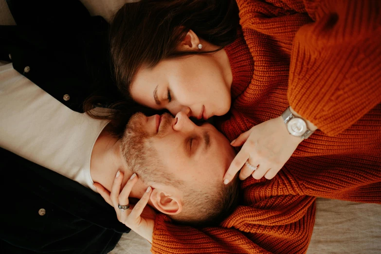 a man and a woman laying on top of each other, trending on pexels, warm cosy colors, russian girlfriend, - photorealistic, sympathetic