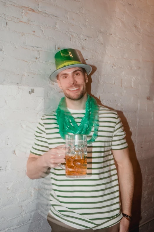 a man in a green hat holding a glass of beer, zachary corzine, lgbtq, multiple stories, caparisons