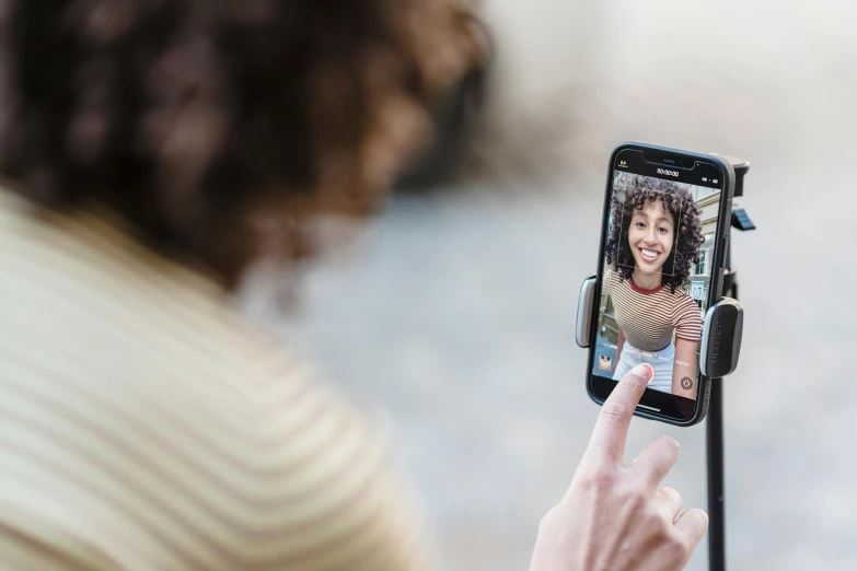 a woman taking a picture of herself on her cell phone, square, fan favorite, thumbnail