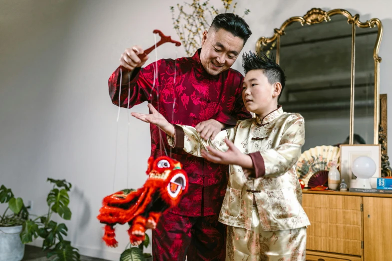 a couple of men standing next to each other, inspired by Gong Xian, pexels contest winner, visual art, string puppet, with a kid, elegantly dressed, instagram photo