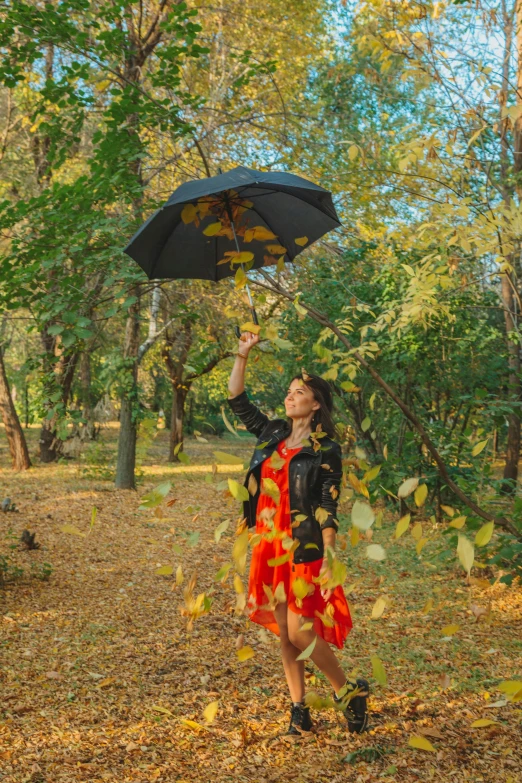 a woman in a red dress holding an umbrella, pexels contest winner, falling leaves, ukraine. professional photo, panoramic view of girl, 15081959 21121991 01012000 4k