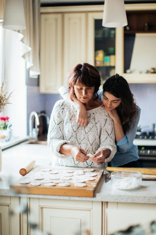 a couple of women standing next to each other in a kitchen, trending on pexels, renaissance, baking cookies, square, mom, tending on pinterest