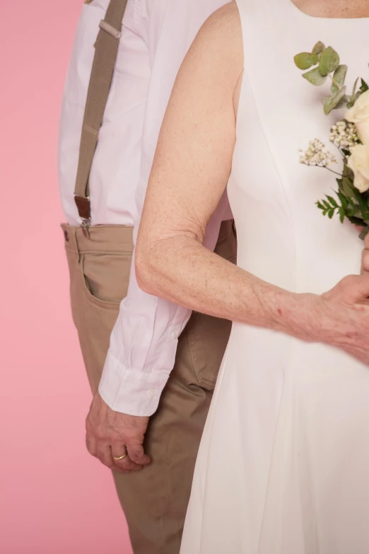 a man standing next to a woman holding a bouquet of flowers, by Alison Geissler, wrinkled, single person, wearing a wedding dress, an elderly