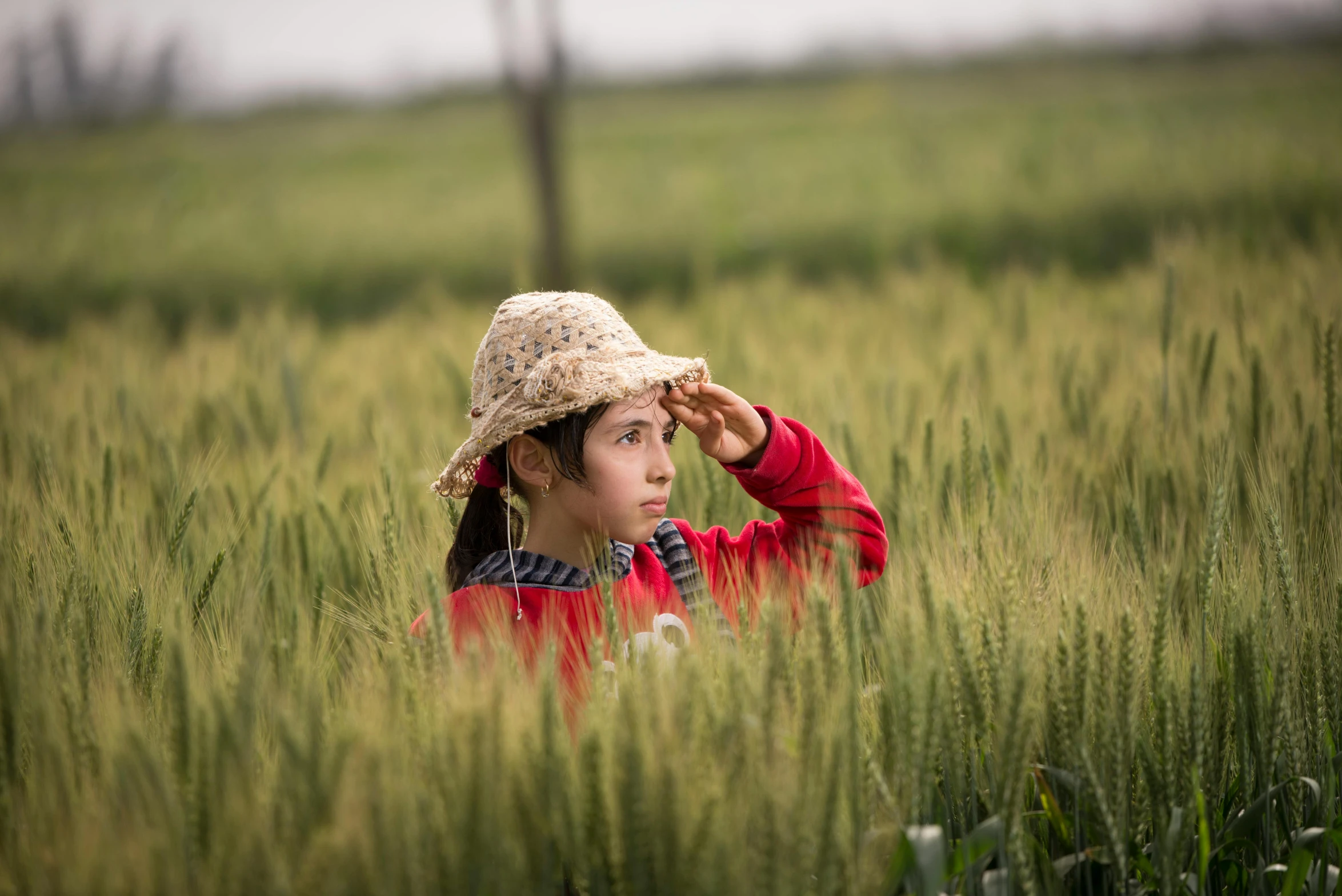 a woman wearing a straw hat in a field, by Lilia Alvarado, villagers busy farming, avatar image, candid photograph, high quality image