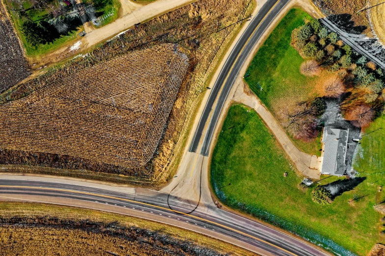 an aerial view of a farm and road, by Carey Morris, pexels contest winner, conceptual art, street corner, thumbnail, from wheaton illinois, detailed 4k photograph