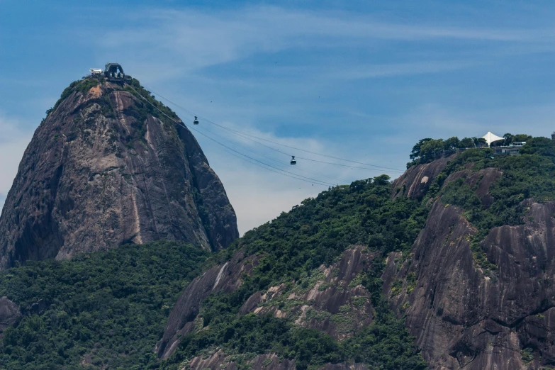 a group of people standing on top of a lush green hillside, by Felipe Seade, pexels contest winner, visual art, trams, granite, avatar image, president of brazil